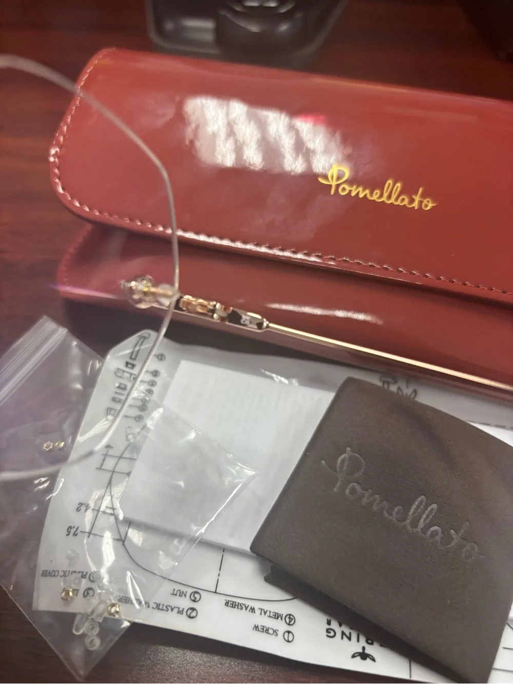 Pomellato Gold Rimless Glasses with Red Case